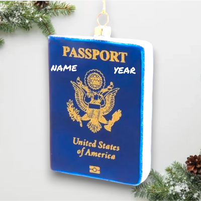 Personalized Glass Passport Christmas Ornament featuring a blue U.S. passport design with gold detailing.
