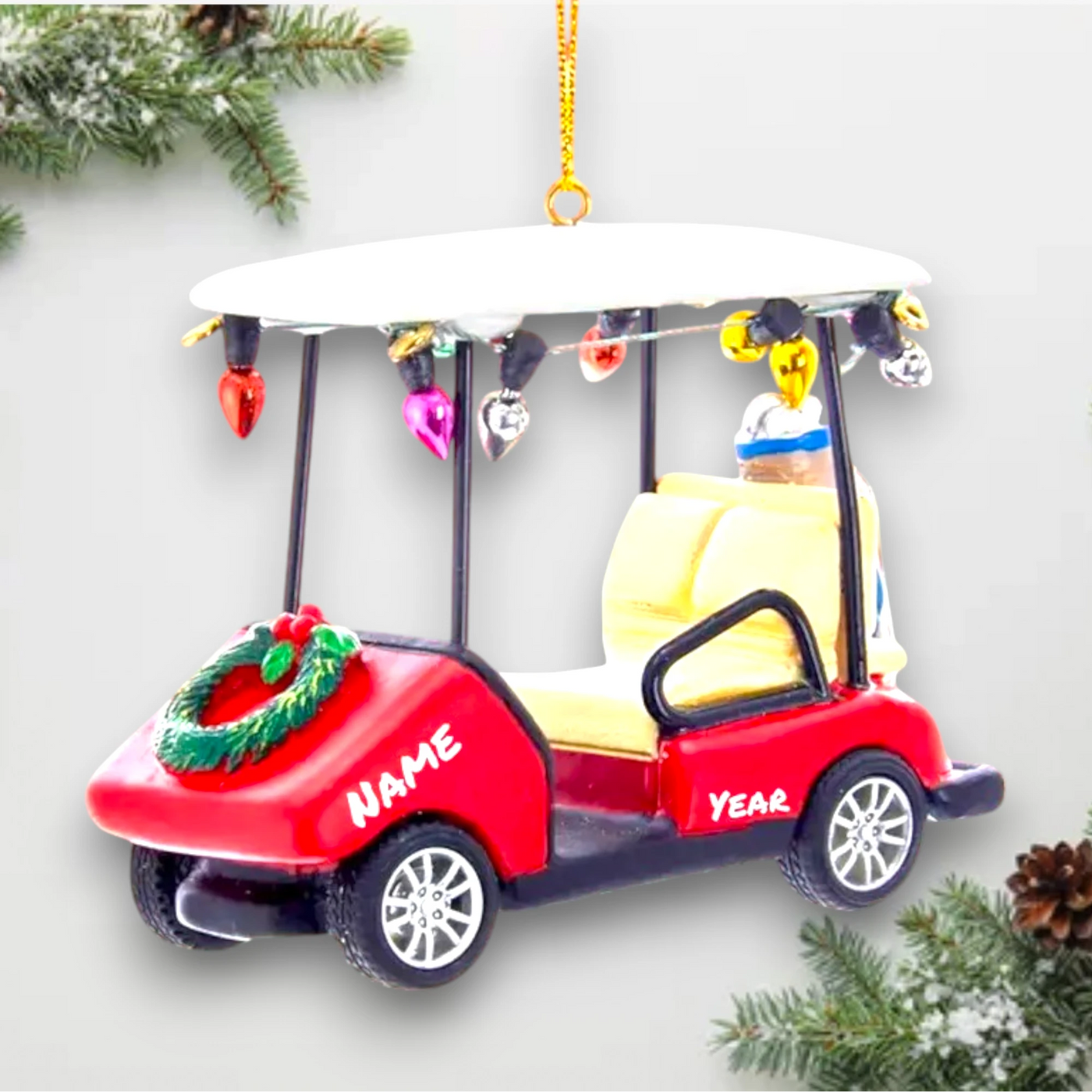 Personalized Golf Cart With Wreath Christmas Ornament featuring a red golf cart decorated with a wreath, colorful lights, and space for a name and year customization.

