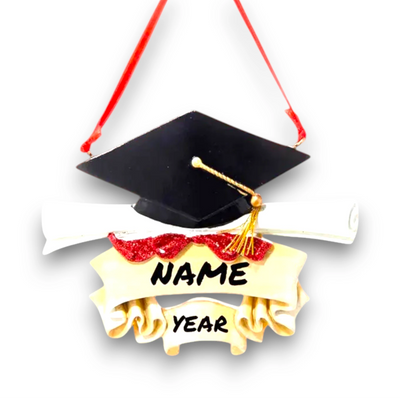 Personalized graduation ornament with a black mortarboard cap, gold tassel, diploma scroll, and customizable ribbon banner.
