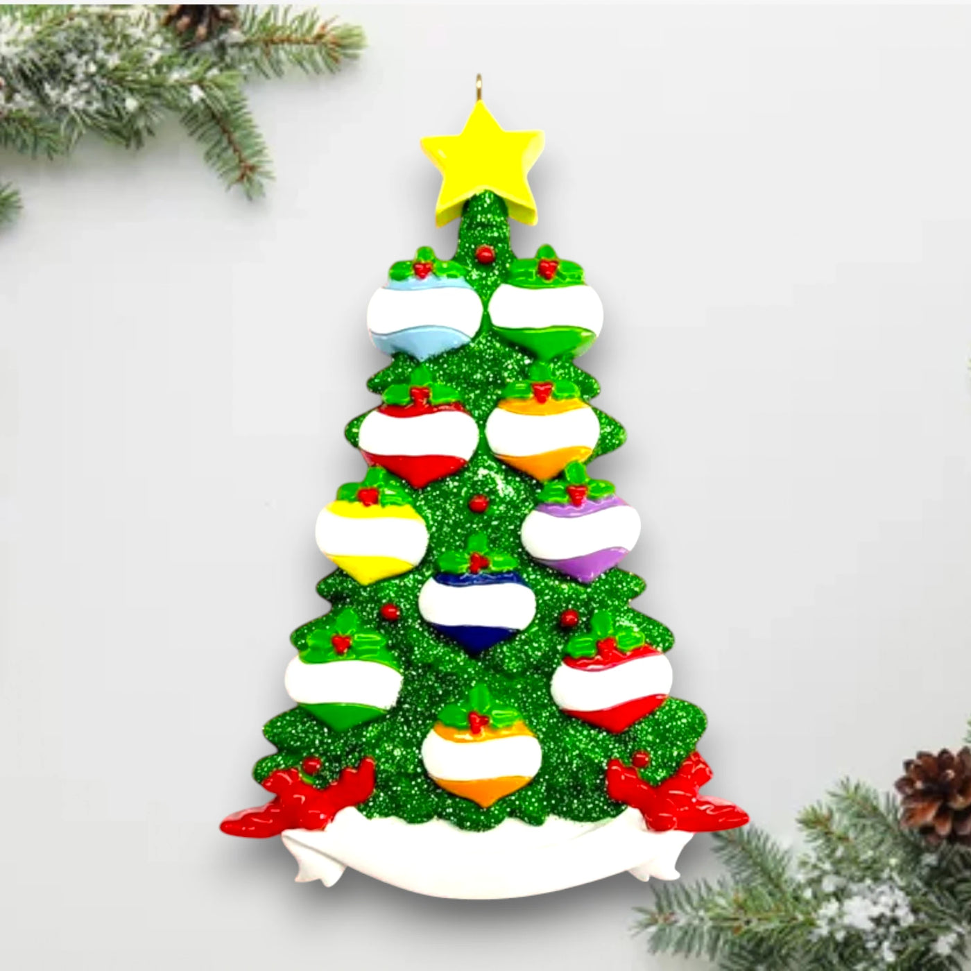 Personalized Green Glitter Tree 10 Christmas Ornament featuring a glittering tree with colorful baubles and a yellow star topper, customizable with up to 10 names and year.

