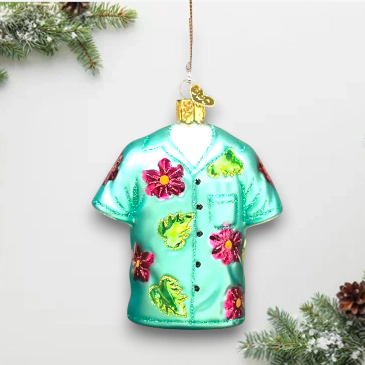 Colorful Hawaiian shirt Christmas ornament with tropical floral patterns, customizable with name and year for a unique holiday keepsake.
