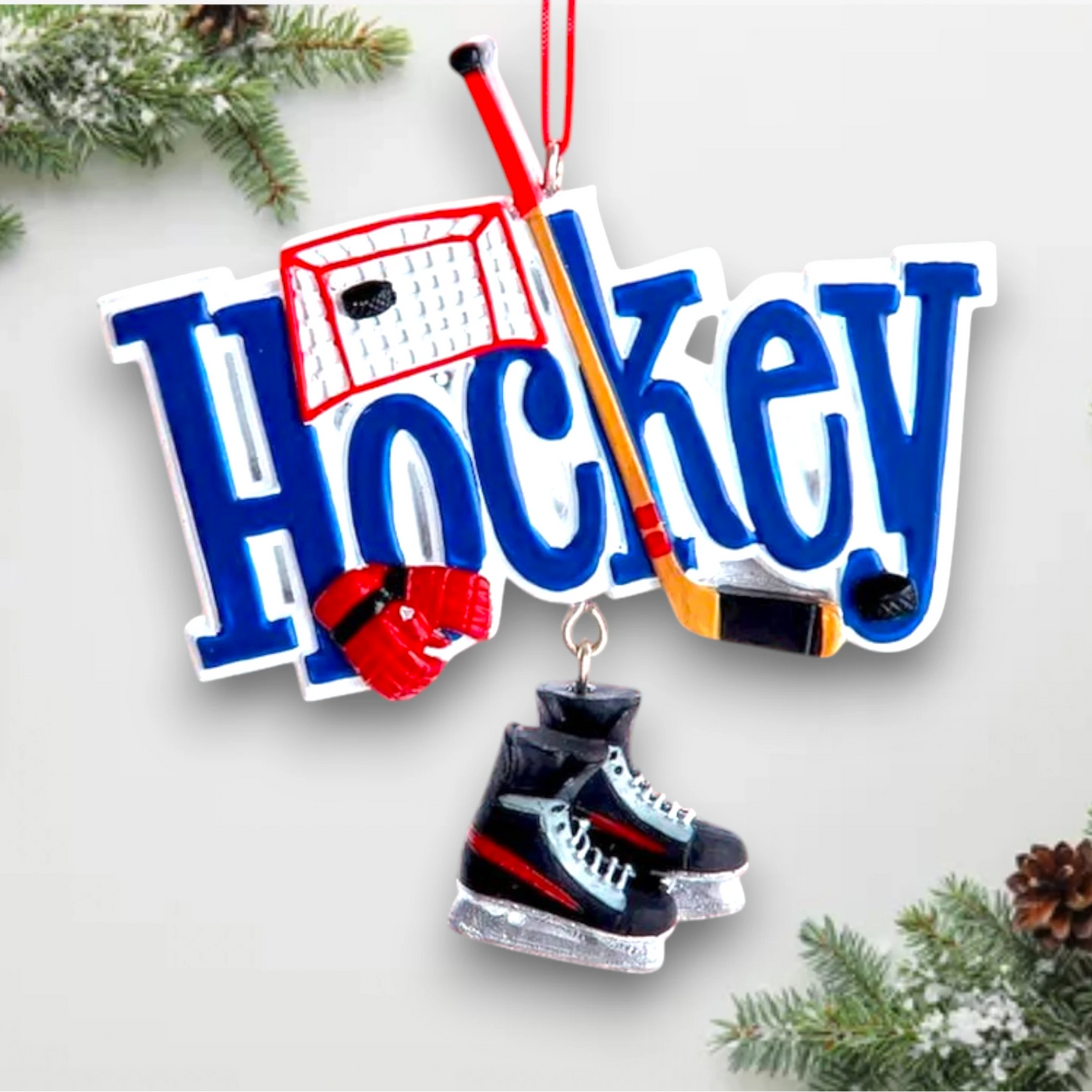 Personalized Hockey Christmas Ornament featuring a hockey stick, net, gloves, and dangling ice skates with space for name and year customization.
