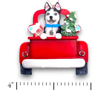 Personalized Husky In Back Of Truck Christmas Ornament featuring a Husky, a festive red truck, a Christmas tree, and a gift, customizable with name and year.
