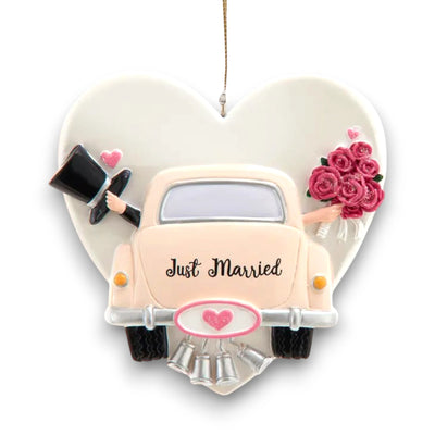 Personalized Just Married wedding car ornament with customizable names and year on a heart-shaped backdrop.