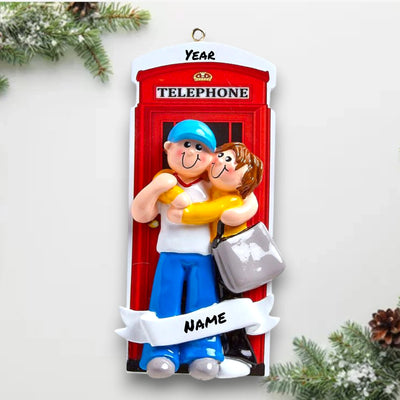 Personalized LOVE IN LONDON Christmas Ornament featuring a couple, a red telephone booth, and customizable names and year.