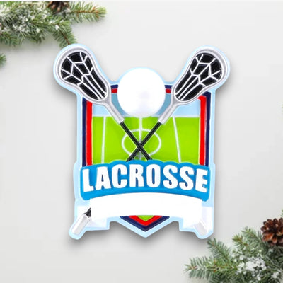 Personalized Lacrosse Shield Christmas Ornament featuring crossed lacrosse sticks, a ball, and a green field design, customizable with name and year.
