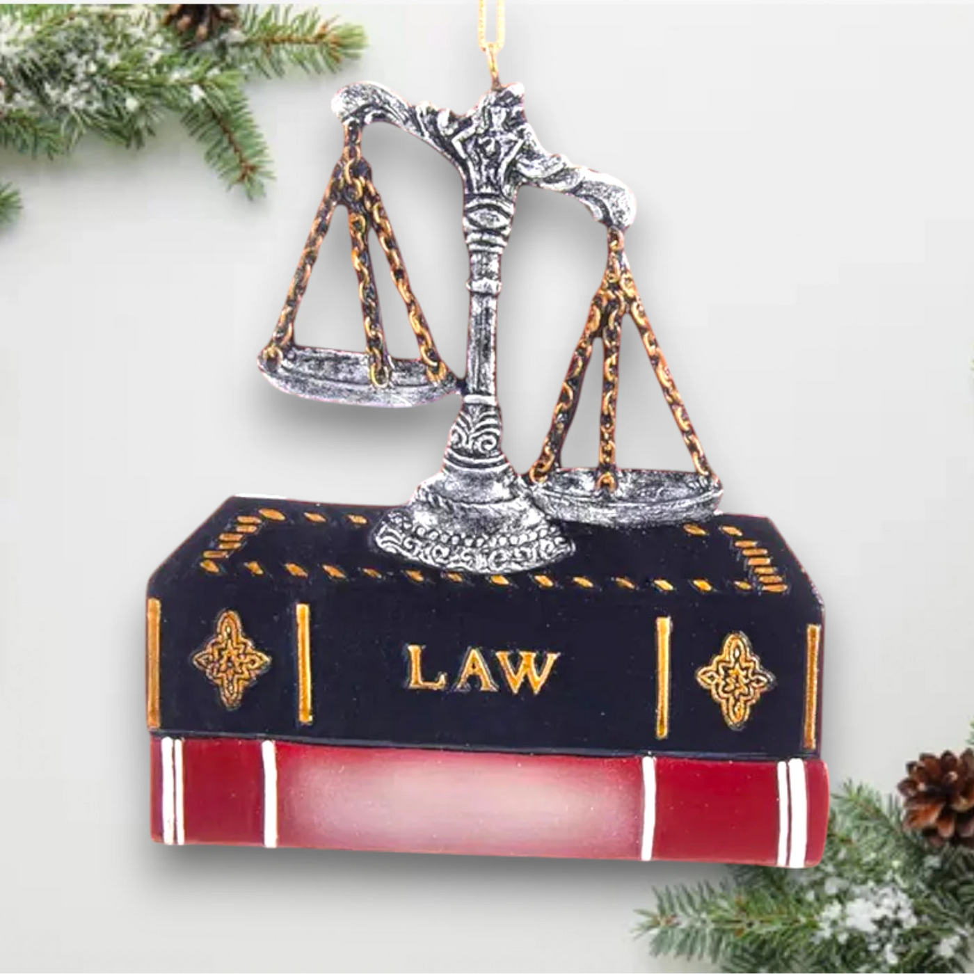 Personalized Lawyer Ornament with scales of justice resting on a law book, customizable with name and year.
