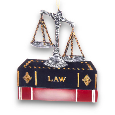 Personalized Lawyer Ornament with scales of justice resting on a law book, customizable with name and year.
