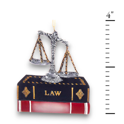 Personalized Lawyer Ornament with scales of justice resting on a law book, customizable with name and year.

