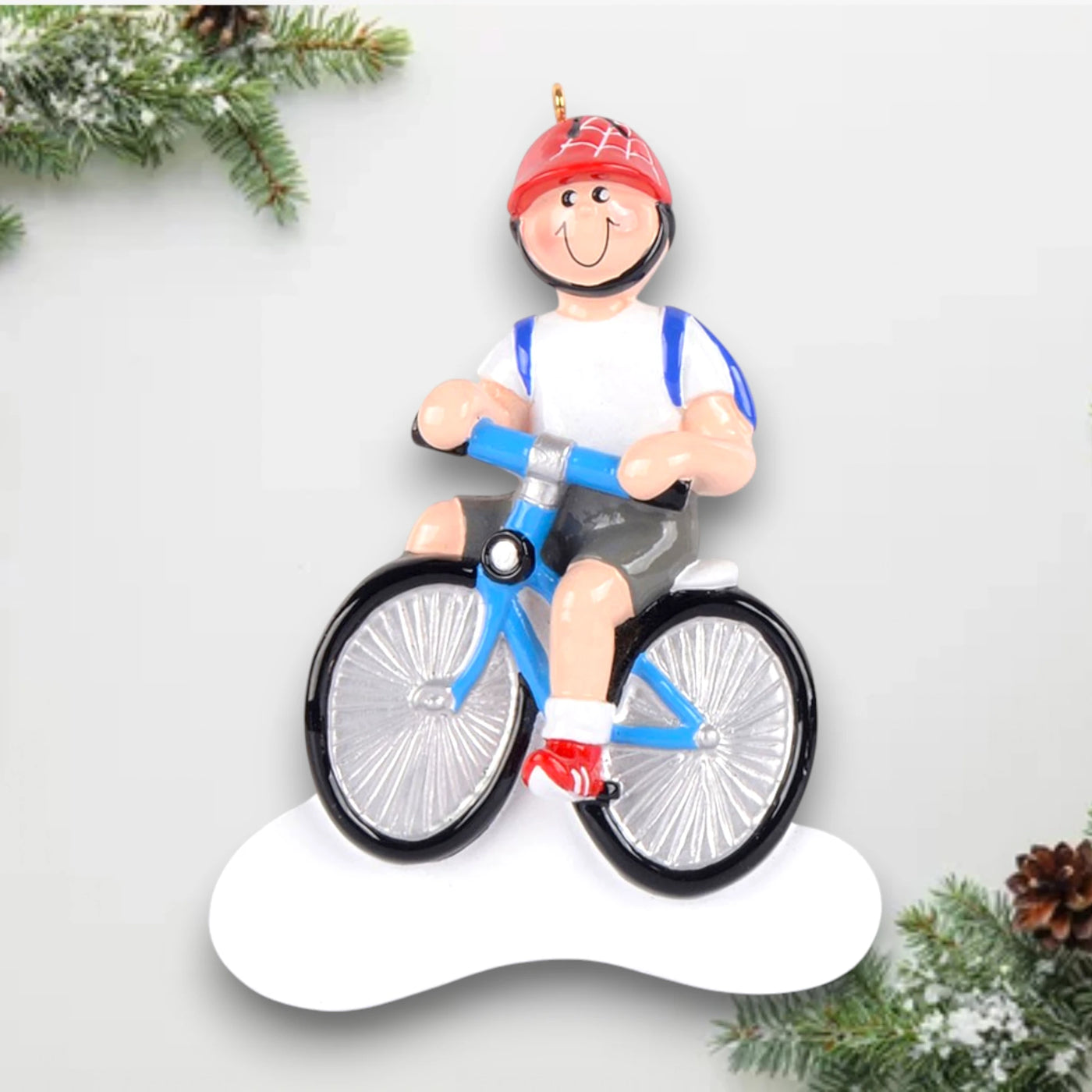 Personalized Little Boy Bike Christmas Ornament featuring a boy riding a blue bike with a red helmet and a backpack, customizable with name and year.

