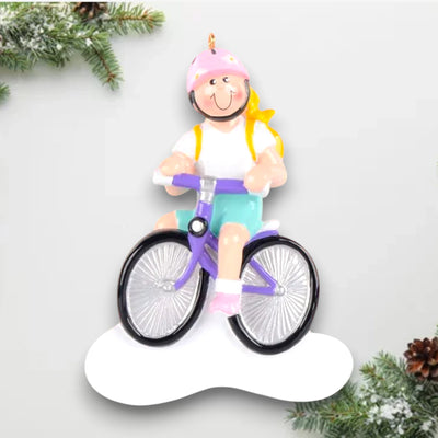 Personalized Little Girl Bike Blonde Christmas Ornament featuring a blonde girl riding a purple bike with a pink helmet and a yellow backpack, customizable with name and year.

