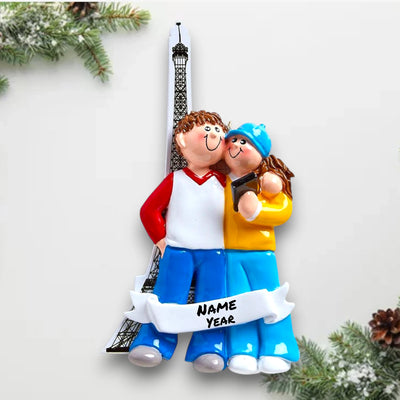 Personalized LOVE IN PARIS Christmas Ornament featuring a couple and the Eiffel Tower with customizable names and year.