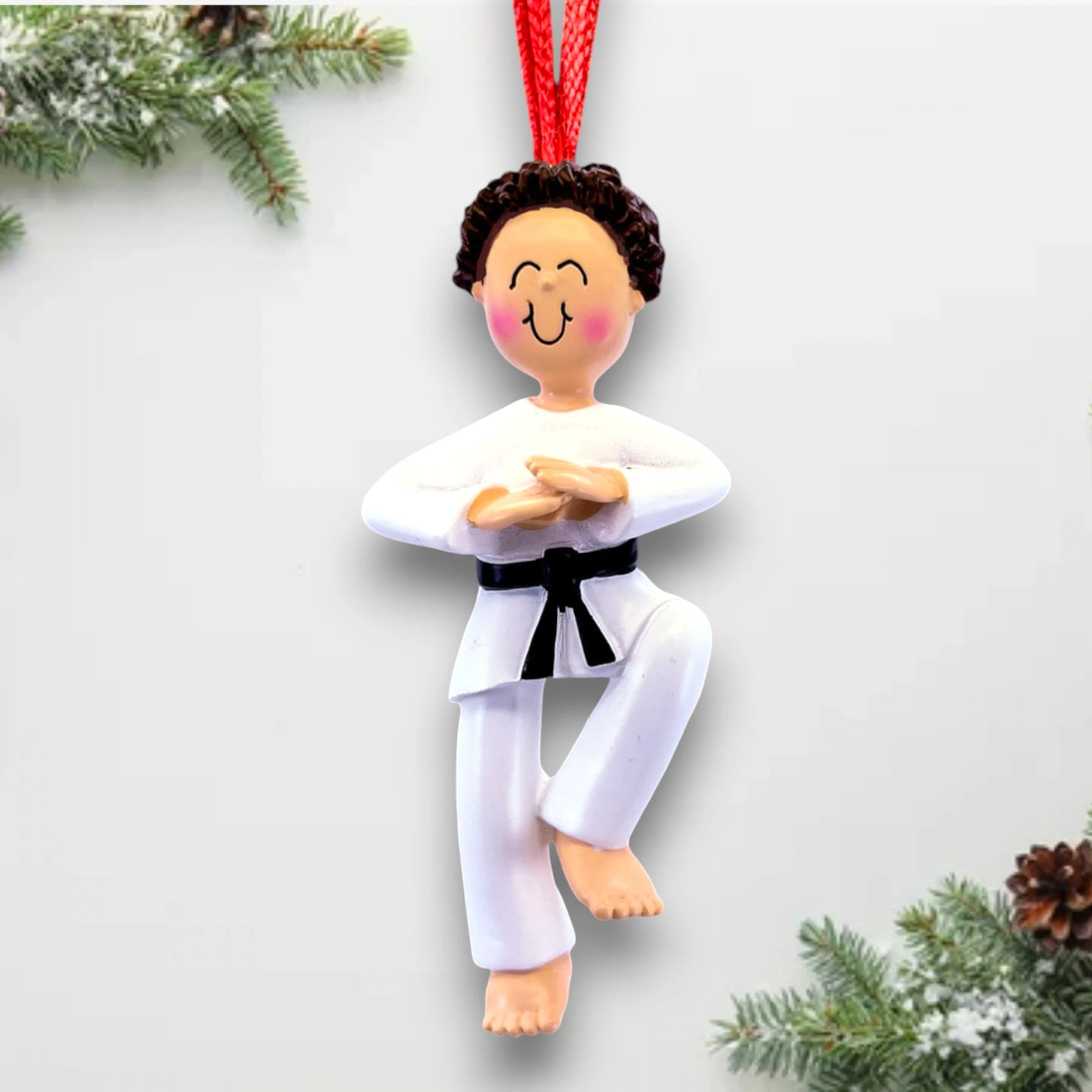 Personalized Male Karate Ornament with Brown Hair, wearing a white gi and black belt, customizable with name and year.

