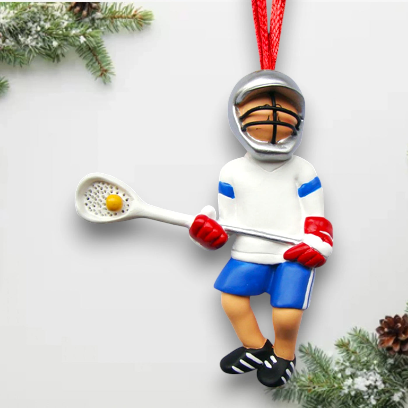 Personalized Male Lacrosse Ornament in white and blue uniform, customizable with name, team, and year.

