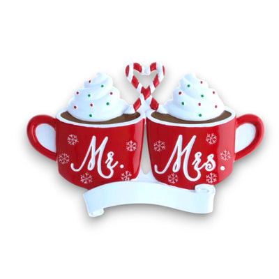 Personalized Mr. & Mrs. Hot Cocoa Christmas Ornament with customizable names and year, featuring two red mugs topped with whipped cream and a candy cane heart.
