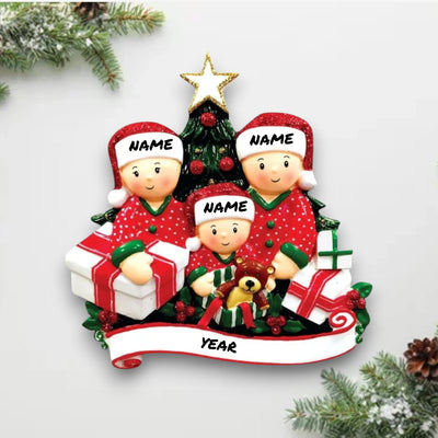  Personalized family of 3 Christmas ornament with family members opening presents under the tree, customizable with names and year.
