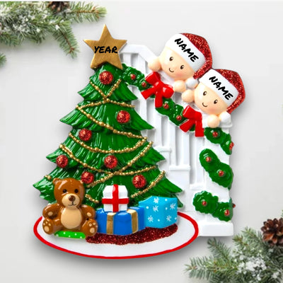  Personalized Peeking Family of 2 Christmas Ornament featuring two figures peeking from behind a Christmas tree with decorations, customizable with names and year.