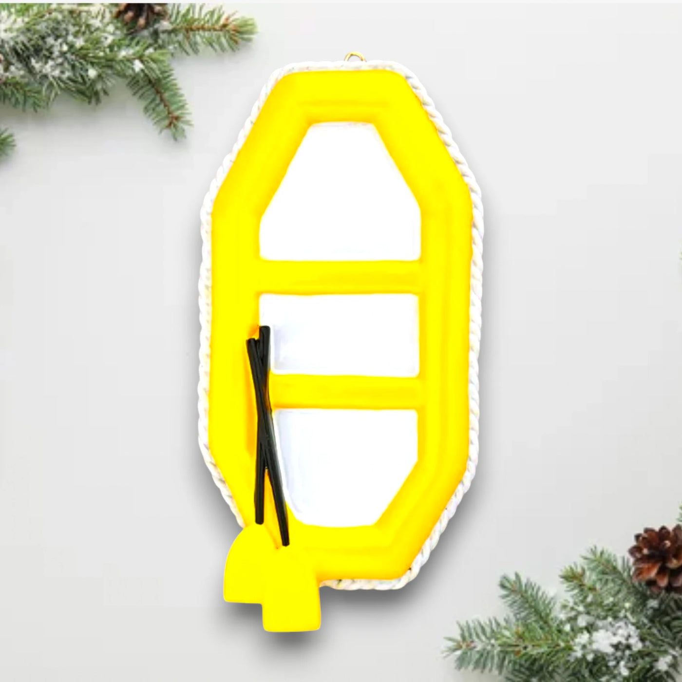 Personalized Raft Christmas Ornament featuring a yellow raft with paddles, customizable with a name and year.

