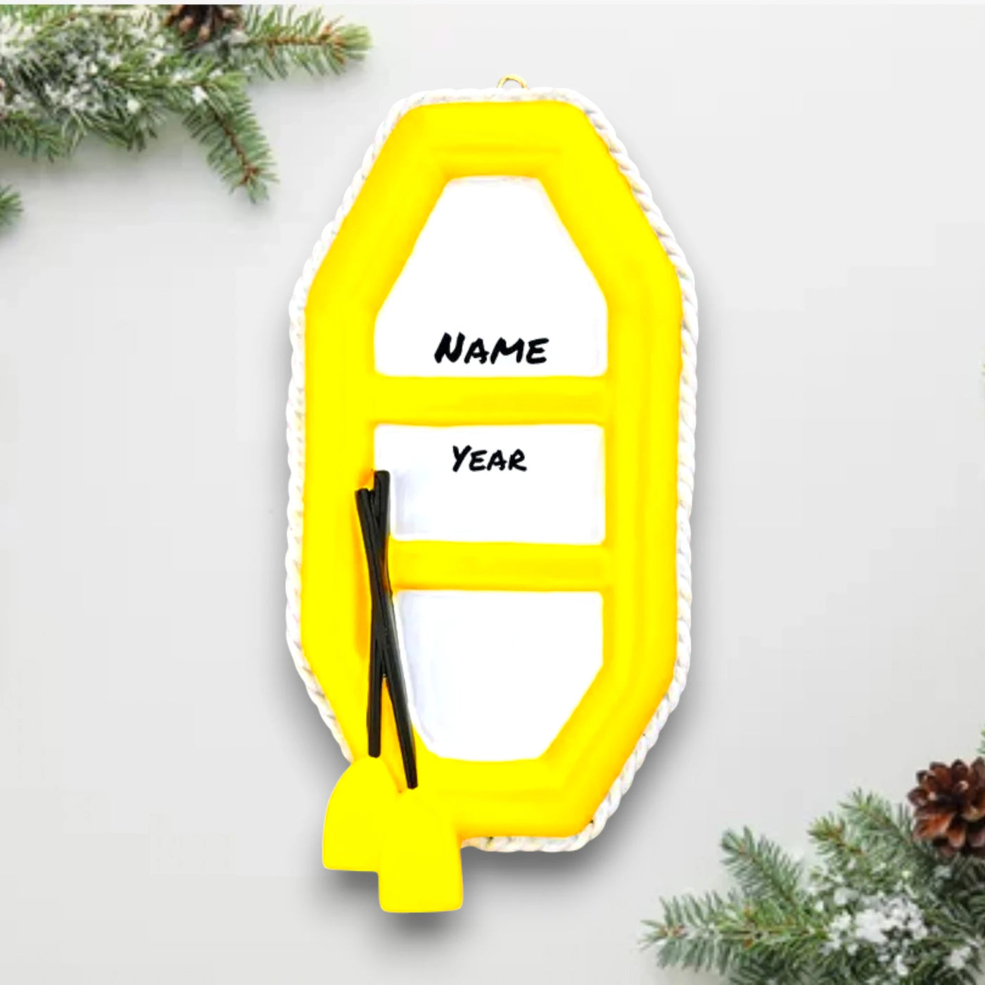 Personalized Raft Christmas Ornament featuring a yellow raft with paddles, customizable with a name and year.


