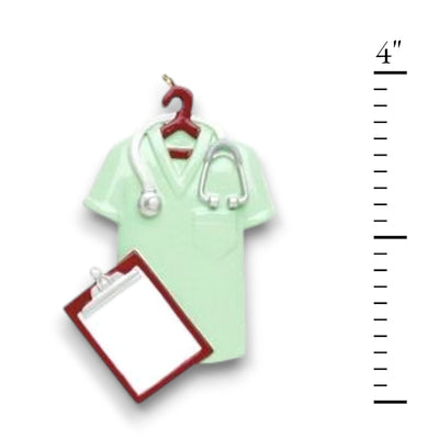 Personalized Scrubs Green Christmas Ornament featuring a scrub top, stethoscope, and clipboard with customizable name and year.