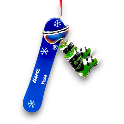 Personalized Snowboard Christmas Ornament featuring a blue snowboard with white snowflake details and dangling green snowboard boots, customizable with name and year.
