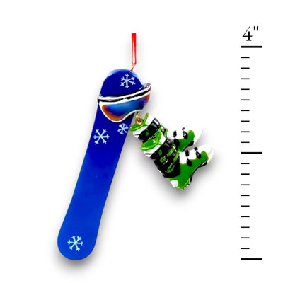 Personalized Snowboard Christmas Ornament featuring a blue snowboard with white snowflake details and dangling green snowboard boots, customizable with name and year.
