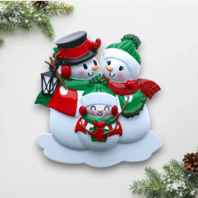 Personalized Snowman Family of 3 Christmas Ornament with customizable names and year, featuring three snowmen in holiday attire with a lantern.