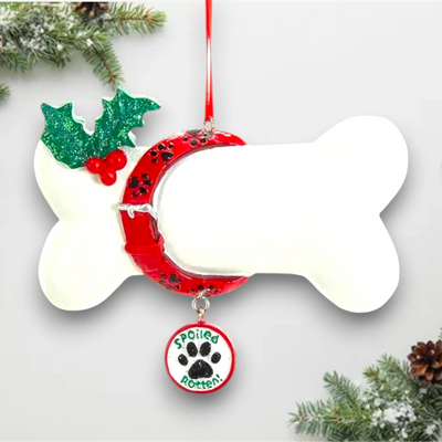 Personalized dog bone ornament with red collar, green holly, and a dangling "Spoiled Rotten" charm, customizable with your dog's name.
