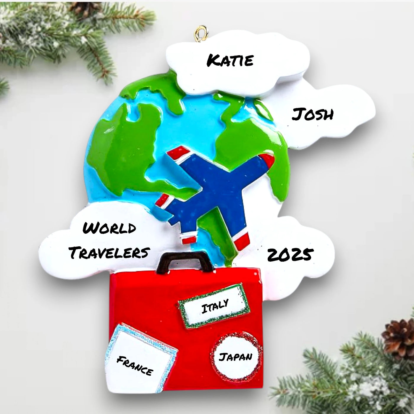 Personalized World Travelers Christmas Ornament featuring a globe, airplane, suitcase, and customizable name, year, and message.