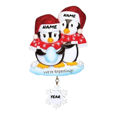  Personalized We're Expecting Penguins Christmas Ornament with customizable names and year, featuring two penguins dressed in festive holiday attire with a snowflake charm.