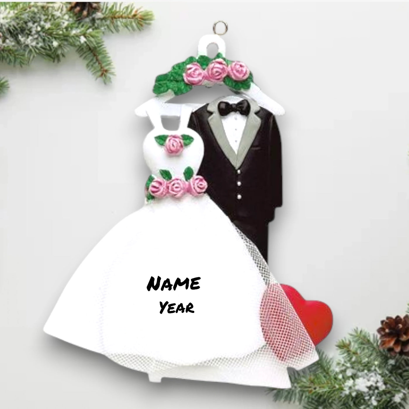 Personalized Wedding Attire Christmas Ornament featuring a wedding dress, tuxedo, and heart with customizable names and year.