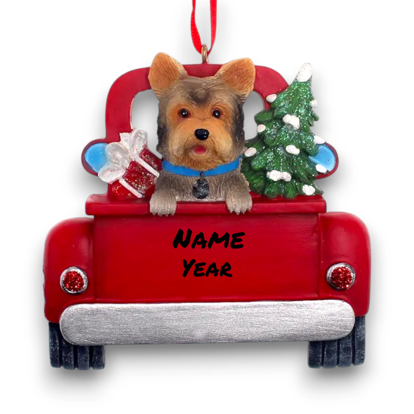 Personalized Yorkshire Terrier In Back Of Truck Christmas Ornament featuring a Yorkshire Terrier, festive Christmas tree, and holiday gifts in a red truck with customizable name and year.