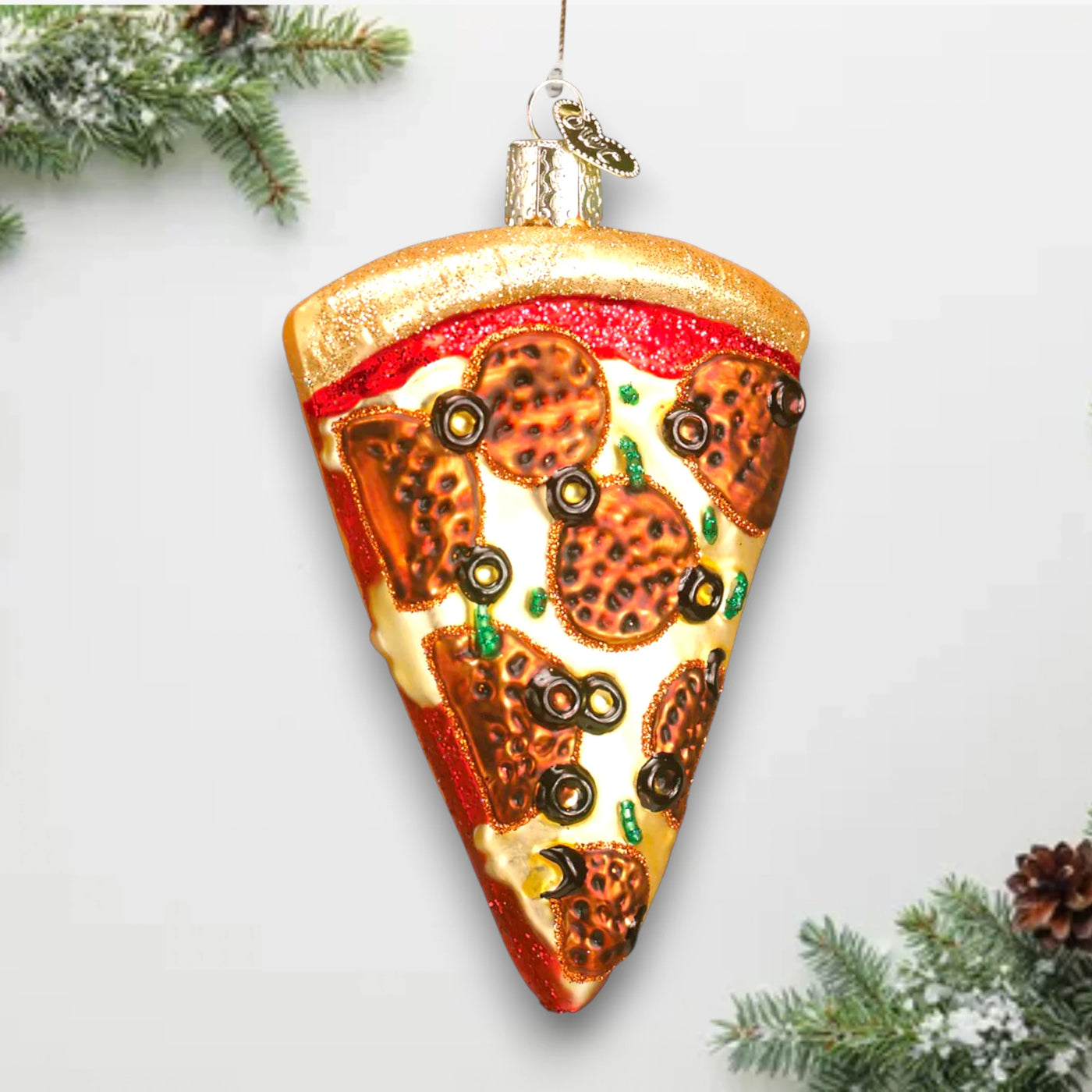 Pizza slice Christmas ornament featuring pepperoni, olives, and melted cheese details with glitter accents, perfect for food lovers.