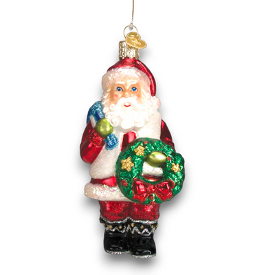 Personalized Santa With Wreath Christmas Ornament featuring Santa Claus holding a green wreath with golden stars and a red bow, customizable with name and year.