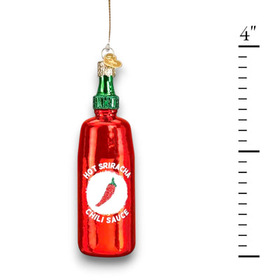 Sriracha Sauce Christmas ornament featuring a bright red bottle with a green cap, glitter accents, and iconic chili pepper label.