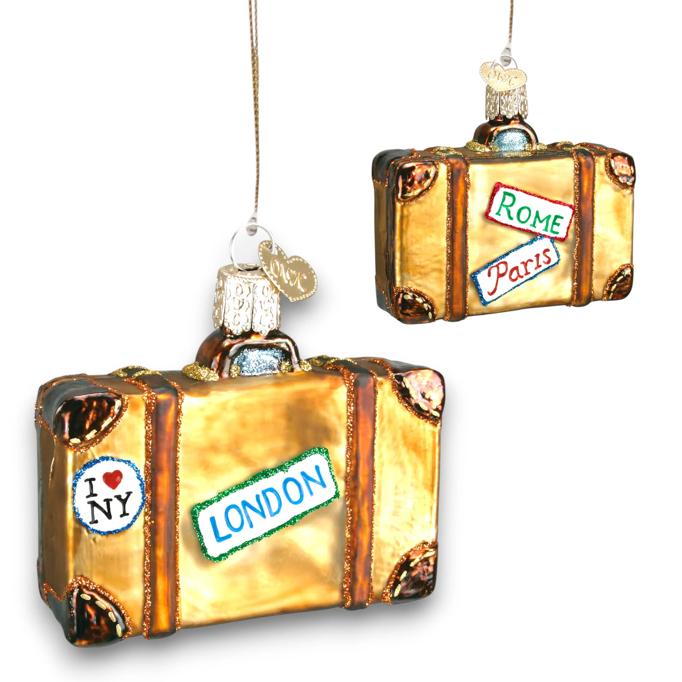 Golden suitcase Christmas ornament with travel destination stickers for Rome, Paris, London, and New York, decorated with glitter details.